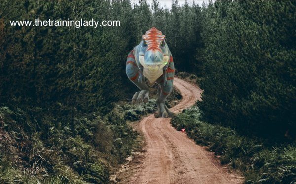 A 3D T-Rex running down a dirt road